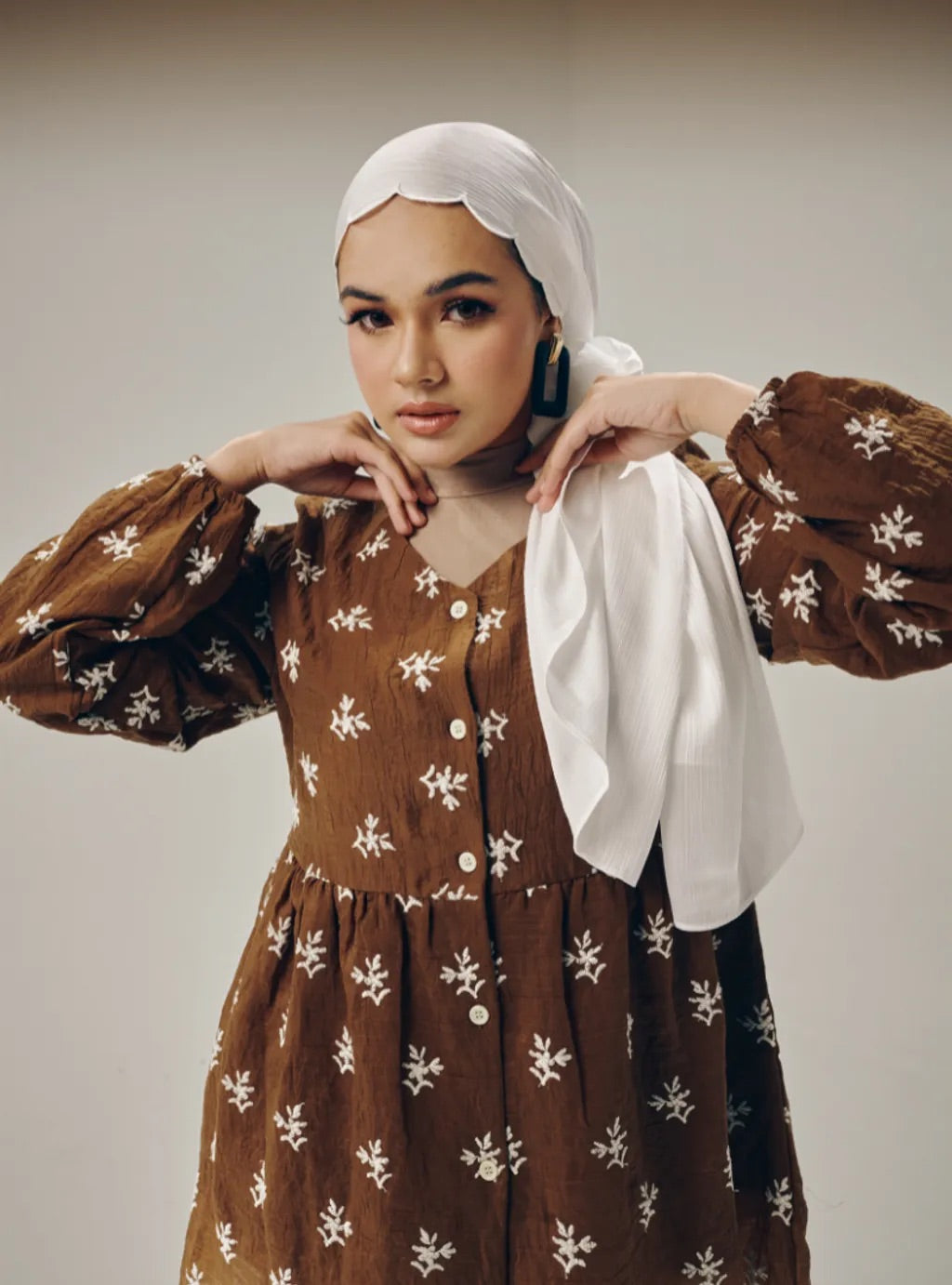 Atasan Ava Peplum Embroidered Top