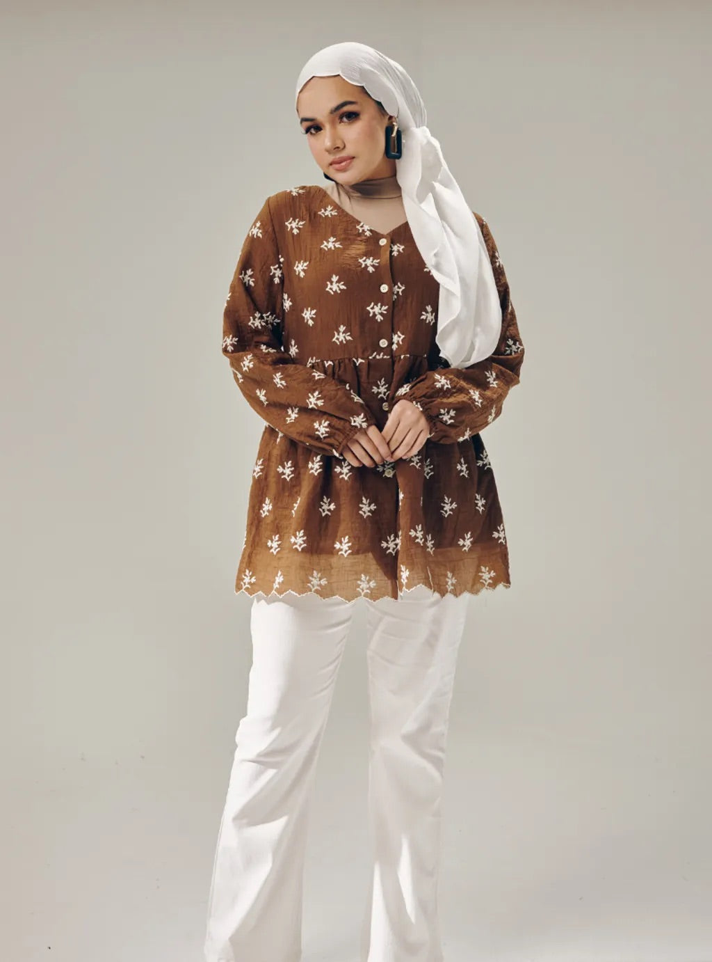 Atasan Ava Peplum Embroidered Top